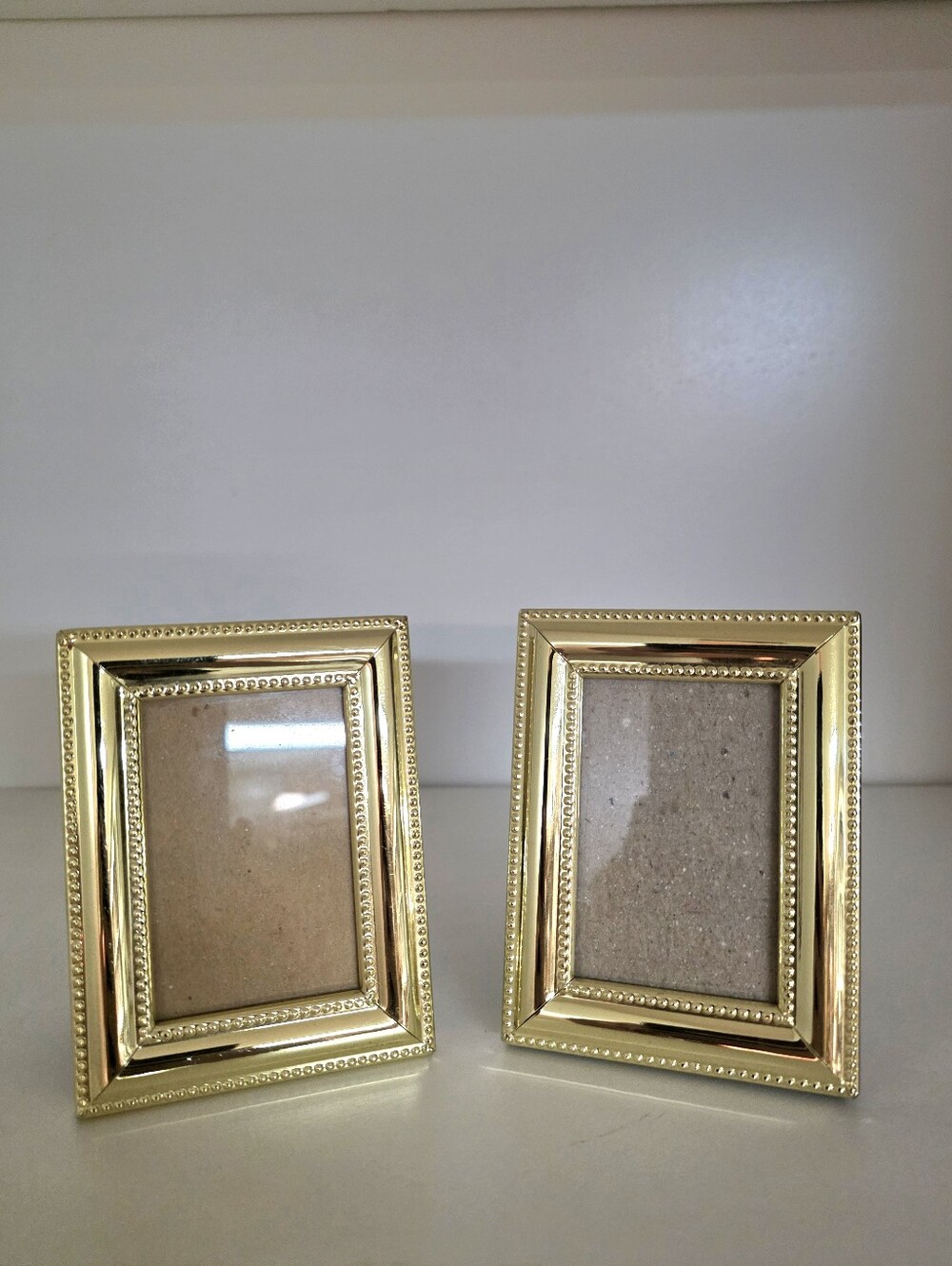 Philip Whitney Ltd Pair of "Hollywood Regency" Gold-Plated Frames